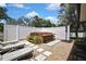Relaxing backyard space featuring a hot tub with bar, lounge chairs and gravel, perfect for entertaining at 13373 Lawrence St, Spring Hill, FL 34609