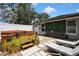 Inviting backyard oasis showcasing a hot tub, patio furniture, and a lush green wall at 13373 Lawrence St, Spring Hill, FL 34609