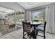 Cozy dining area with views of the pool and lanai at 13373 Lawrence St, Spring Hill, FL 34609