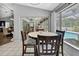 Dining area next to a big window with view of the pool at 13373 Lawrence St, Spring Hill, FL 34609