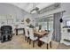 Chic dining space with a rustic table, comfortable chairs, and modern decorative touches at 13373 Lawrence St, Spring Hill, FL 34609