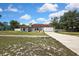 Single-story home with a well-manicured lawn and an attached two-car garage at 13373 Lawrence St, Spring Hill, FL 34609