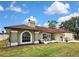 Charming single-story home with a well-maintained lawn and cozy front patio area at 13373 Lawrence St, Spring Hill, FL 34609