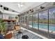Bright Florida room featuring a wet bar and sliding glass doors leading to the pool area at 13373 Lawrence St, Spring Hill, FL 34609