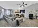Inviting living room features a cozy sectional sofa, fireplace, and entertainment setup at 13373 Lawrence St, Spring Hill, FL 34609