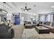 Large, open-concept living space with a stylish sectional sofa and ample natural light at 13373 Lawrence St, Spring Hill, FL 34609