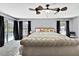 Spacious main bedroom with ceiling fans and a view of the pool area at 13373 Lawrence St, Spring Hill, FL 34609