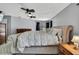 Main bedroom with a large upholstered bed and carpet flooring at 13373 Lawrence St, Spring Hill, FL 34609