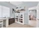 Bedroom showcasing a shelving unit, desk area, and view into the dining room at 13524 Knotty Ln, Hudson, FL 34669