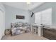 Cozy bedroom featuring a daybed, desk, and soft, neutral tones at 13524 Knotty Ln, Hudson, FL 34669