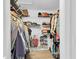 Spacious walk-in closet with ample shelving and hanging storage, perfect for organization at 13524 Knotty Ln, Hudson, FL 34669