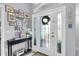 Warm foyer with decorative accents, a wreath, and a tiled floor at 13524 Knotty Ln, Hudson, FL 34669