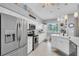 Modern kitchen featuring stainless steel appliances, ample counter space, and white cabinetry at 13524 Knotty Ln, Hudson, FL 34669