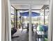 Inviting screened patio with outdoor seating, perfect for relaxation and entertaining with a view of the pool at 13524 Knotty Ln, Hudson, FL 34669