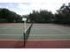 Well-maintained community tennis courts ready for a friendly match and active living at 13524 Knotty Ln, Hudson, FL 34669