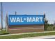 The Walmart store sign advertises retail shopping options for homeowners at 13524 Knotty Ln, Hudson, FL 34669