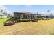 Backyard featuring a screen enclosed lanai at 1420 Winding Willow Dr, Trinity, FL 34655