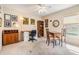 Bedroom with neutral walls, ceiling fan, art on the walls, and desk with chair at 1420 Winding Willow Dr, Trinity, FL 34655