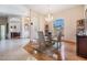 Bright dining room featuring an elegant chandelier and an open floorplan at 1420 Winding Willow Dr, Trinity, FL 34655