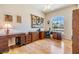 Functional home office space with a large window for natural light and hardwood floors at 1420 Winding Willow Dr, Trinity, FL 34655