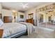 Spacious main bedroom with an outdoor access and a matching furniture set at 1420 Winding Willow Dr, Trinity, FL 34655