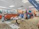 Well-stocked pro shop with golf apparel, equipment, and accessories on display, featuring natural light from nearby windows at 1420 Winding Willow Dr, Trinity, FL 34655