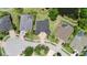 Well-maintained home features lush landscaping, an expansive driveway, and serene water views at 15906 Prince William Pl, Odessa, FL 33556