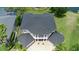 Upscale home displays a detailed roofline, stately columns, and a manicured brick driveway at 15906 Prince William Pl, Odessa, FL 33556