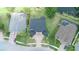 Expansive home featuring a paved driveway, well-manicured lawn, and proximity to a scenic pond at 15906 Prince William Pl, Odessa, FL 33556