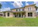 Spacious backyard featuring a well-manicured lawn and statues of lions enhancing the property's curb appeal at 15906 Prince William Pl, Odessa, FL 33556