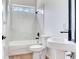 Bathroom featuring a tub with marble surround, a white toilet, and a modern sink at 15906 Prince William Pl, Odessa, FL 33556