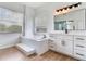 Bathroom with a bathtub and a vanity at 15906 Prince William Pl, Odessa, FL 33556