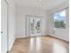Bedroom with wood floors and french doors at 15906 Prince William Pl, Odessa, FL 33556