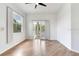 Bedroom featuring wood flooring and french doors leading to outdoor space at 15906 Prince William Pl, Odessa, FL 33556