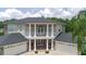Elegant two-story home features grand columns, double garages, and manicured front yard at 15906 Prince William Pl, Odessa, FL 33556