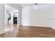 Open living room showcasing light wood flooring and ample natural light at 15906 Prince William Pl, Odessa, FL 33556