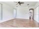 Spacious living room featuring wood flooring and a ceiling fan at 15906 Prince William Pl, Odessa, FL 33556