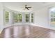 Bright living room featuring bay windows that let in lots of natural light at 15906 Prince William Pl, Odessa, FL 33556