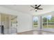 Bright living room featuring sliding glass doors and natural light at 15906 Prince William Pl, Odessa, FL 33556
