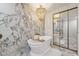 Elegant bathroom with freestanding tub, marble accents, and a stylish chandelier at 1700 Beachway Ln, Odessa, FL 33556