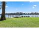 Wooden dock on a serene lake, perfect for fishing, boating, or enjoying the waterfront views at 1700 Beachway Ln, Odessa, FL 33556