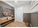 Cozy entryway with wooden bench, storage, light walls and wood-look flooring at 1700 Beachway Ln, Odessa, FL 33556
