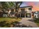 Charming raised home with covered parking, lush lawn, and beautifully landscaped front yard at 1700 Beachway Ln, Odessa, FL 33556
