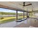 This outdoor patio features exercise equipment and a waterfront view of the lake at 1700 Beachway Ln, Odessa, FL 33556