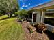 Secluded backyard with lush landscaping, a grill, and seating at 18027 Baywood Forest Dr, Hudson, FL 34667