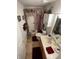 Cozy bathroom featuring tile flooring, modern fixtures, and decorative accents at 18027 Baywood Forest Dr, Hudson, FL 34667