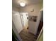 Hallway view featuring wood-look floors and neutral paint at 18027 Baywood Forest Dr, Hudson, FL 34667