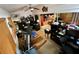 Bright office with a ceiling fan, hardwood floors, and sliding doors at 18027 Baywood Forest Dr, Hudson, FL 34667