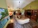 Spacious living room featuring wood floors and a large sectional sofa at 18027 Baywood Forest Dr, Hudson, FL 34667