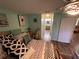 Comfortable bedroom with an en-suite bathroom and calming green walls at 18027 Baywood Forest Dr, Hudson, FL 34667